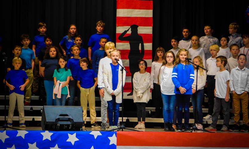 Students sing in Veterans Day performance